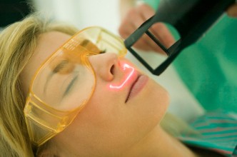 Woman receiving facial skin treatment